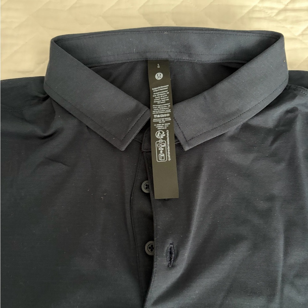 Lululemon Athletica navy evolution short sleeve polo